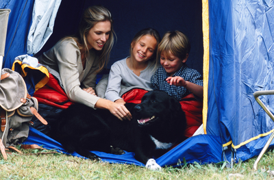 Family in tent with pet